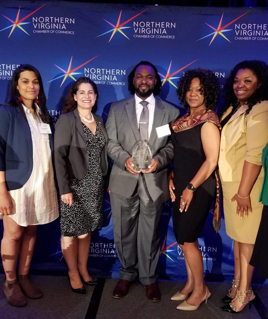 Vernon Green holding the first-place award in the Small Business category at the Northern Virginia Chamber of Commerce Good Business of the Year