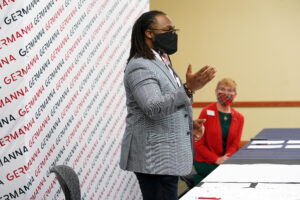 Vernon Green Jr. speaking while Dr. Janet Gullickson from Germanna is seated nearby