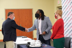 Vernon Green Jr. shaking hands