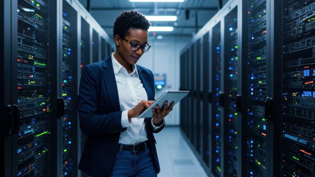 IT professional using tablet in data center 