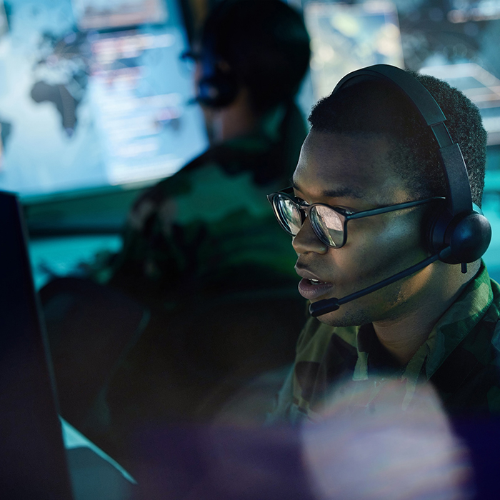 Military control room, computer and man with headset