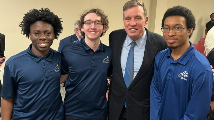 Mark Warner with Interns